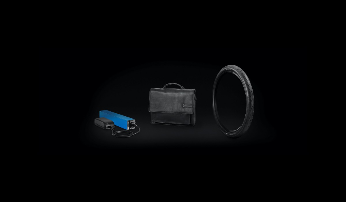 Accessoires de vélo électrique Stromer : batterie Stromer BQ983 avec chargeur, sacoche arrière Stromer Berlin en cuir et pneus Pirelli Angel ST Sport. 