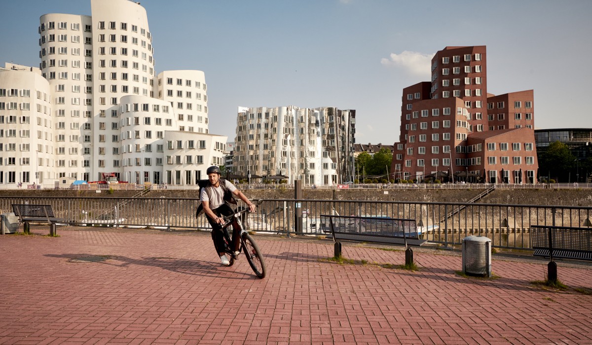 man riding a speed pedelec on the streets